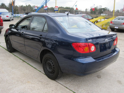 toyota corolla 2004 dk  blue sedan le gasoline 4 cylinders front wheel drive automatic with overdrive 77379