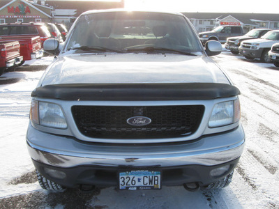 ford f 150 2002 silver xlt fx4 gasoline 8 cylinders 4 wheel drive automatic with overdrive 55811