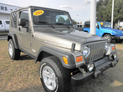 jeep wrangler 2004 gold suv rubicon gasoline 6 cylinders 4 wheel drive 5 speed manual 34474
