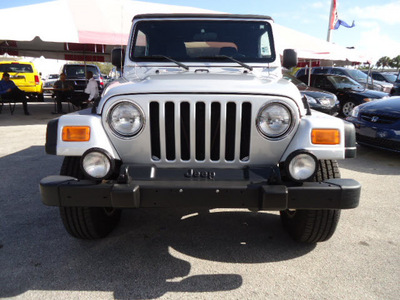 jeep wrangler 2004 silver suv sport gasoline 6 cylinders 4 wheel drive automatic 33157