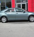 toyota camry 2009 green sedan le gasoline 4 cylinders front wheel drive automatic 33884