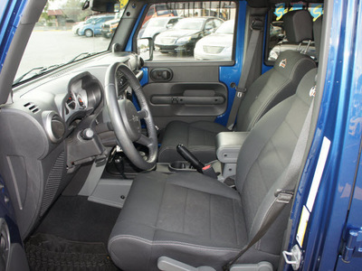 jeep wrangler unlimited 2010 blue suv sport gasoline 6 cylinders 4 wheel drive 6 speed manual 33021