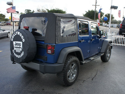 jeep wrangler unlimited 2010 blue suv sport gasoline 6 cylinders 4 wheel drive 6 speed manual 33021