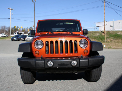 jeep wrangler unlimited 2009 orange suv x gasoline 6 cylinders 4 wheel drive automatic 27215