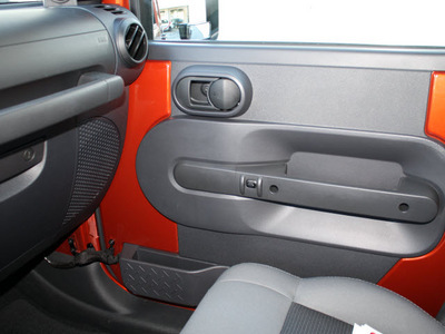 jeep wrangler unlimited 2009 orange suv x gasoline 6 cylinders 4 wheel drive automatic 27215