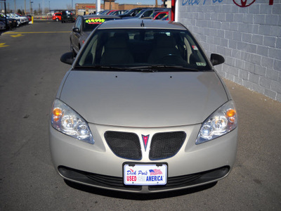 pontiac g6 2009 gold sedan gasoline 4 cylinders front wheel drive automatic 79925