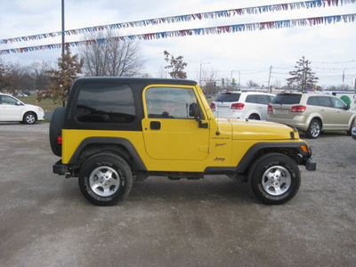 jeep wrangler 2002 yellow suv sport gasoline 6 cylinders 4 wheel drive automatic 62863