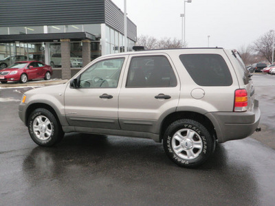 ford escape 2001 beige suv xlt gasoline 6 cylinders 4 wheel drive automatic with overdrive 55124