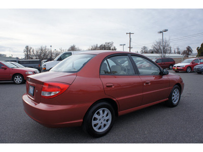 kia rio 2005 red sedan gasoline 4 cylinders front wheel drive 5 speed manual 99336