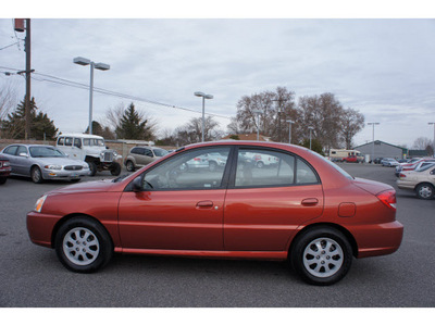 kia rio 2005 red sedan gasoline 4 cylinders front wheel drive 5 speed manual 99336