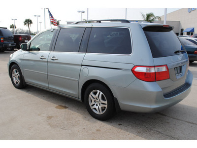 honda odyssey 2005 silver van ex l w dvd w navi gasoline 6 cylinders front wheel drive automatic with overdrive 77065