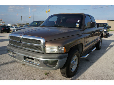 dodge ram pickup 1500 2000 beige pickup truck slt gasoline v8 rear wheel drive automatic 77037