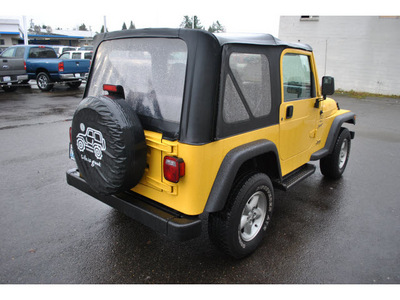 jeep wrangler 2001 yellow suv sport gasoline 6 cylinders 4 wheel drive automatic 98371