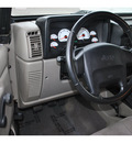 jeep wrangler 2003 khaki suv sport gasoline 6 cylinders 4 wheel drive 5 speed manual 98371