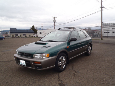 subaru impreza 1999 green wagon outback sport gasoline 4 cylinders all whee drive 4 speed manual 98632