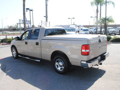 ford f 150 2007 gold xlt gasoline 8 cylinders rear wheel drive automatic 91010