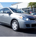 nissan versa 2010 silver hatchback 1 8 gasoline 4 cylinders front wheel drive automatic 33177
