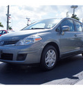 nissan versa 2010 silver hatchback 1 8 gasoline 4 cylinders front wheel drive automatic 33177