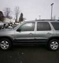 mazda tribute 2004 green suv lx gasoline 6 cylinders 4 wheel drive automatic with overdrive 13502