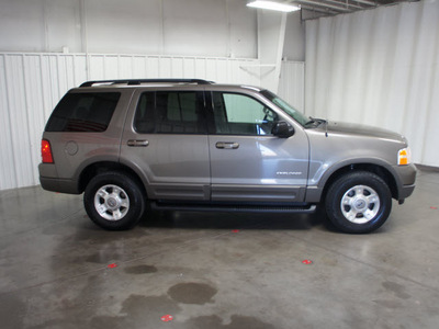 ford explorer 2002 gold suv xlt flex fuel 6 cylinders rear wheel drive automatic with overdrive 76108