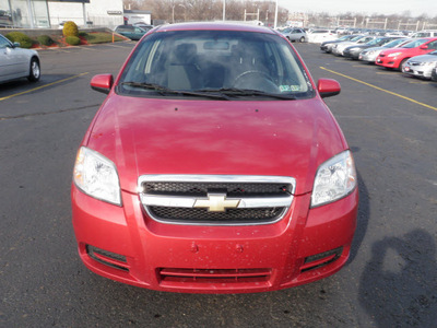 chevrolet aveo 2010 red sedan lt gasoline 4 cylinders front wheel drive automatic 19153