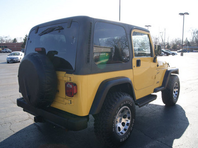 jeep wrangler 2000 yellow suv sport gasoline 6 cylinders 4 wheel drive automatic 61008