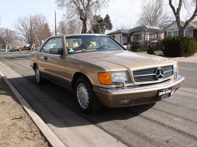 mercedes benz 560 class 1986 gold coupe 560sec gasoline 8 cylinders rear wheel drive automatic 80110