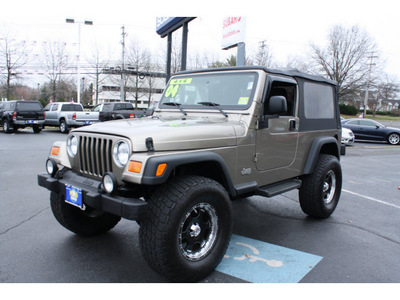 jeep wrangler 2004 light khaki suv unlimited gasoline 6 cylinders 4 wheel drive automatic with overdrive 07701