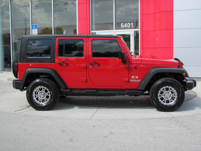 jeep wrangler 2009 red suv unlimited x gasoline 6 cylinders 4 wheel drive automatic 33884