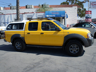 nissan frontier 2002 yellow xe v6 gasoline 6 cylinders rear wheel drive 5 speed with overdrive 92882