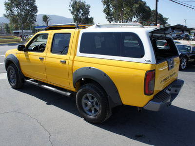 nissan frontier 2002 yellow xe v6 gasoline 6 cylinders rear wheel drive 5 speed with overdrive 92882