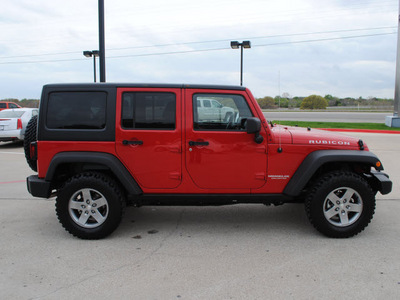 jeep wrangler unlimited 2012 red suv rubicon gasoline 6 cylinders 4 wheel drive automatic 76087