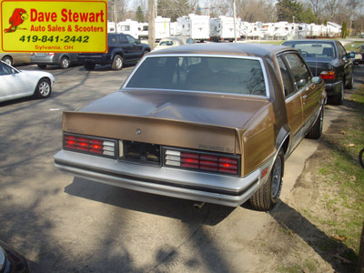 pontiac phoenix 1982 gold coupe gasoline 6 cylinders front wheel drive 5 speed manual 43560