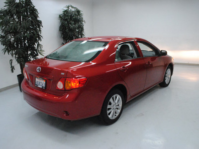 toyota corolla 2010 red sedan le gasoline 4 cylinders front wheel drive automatic 91731