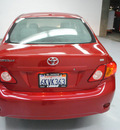 toyota corolla 2010 red sedan le gasoline 4 cylinders front wheel drive automatic 91731