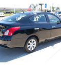 nissan versa 2012 black sedan 1 6 sl gasoline 4 cylinders front wheel drive automatic with overdrive 77065