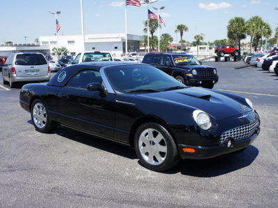 ford thunderbird 2002 black deluxe gasoline 8 cylinders rear wheel drive automatic 33021