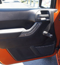 jeep wrangler 2011 orange suv sport gasoline 6 cylinders 4 wheel drive 6 speed manual 33021