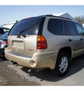 gmc envoy 2006 beige suv sle gasoline 6 cylinders 4 wheel drive automatic with overdrive 08902