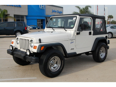 jeep wrangler 1998 white suv sport gasoline 6 cylinders 4 wheel drive 5 speed manual 77065