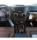 jeep wrangler 2012 black suv sahara gasoline 6 cylinders 4 wheel drive automatic 33157