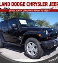 jeep wrangler unlimited 2012 black suv sahara gasoline 6 cylinders 4 wheel drive automatic 33157