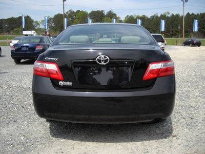 toyota camry 2009 black sedan le gasoline 4 cylinders front wheel drive automatic 27569
