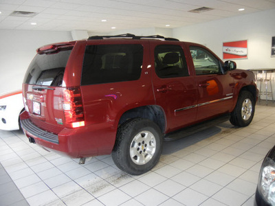 chevrolet tahoe 2011 dk  red suv lt flex fuel 8 cylinders 4 wheel drive automatic with overdrive 55391
