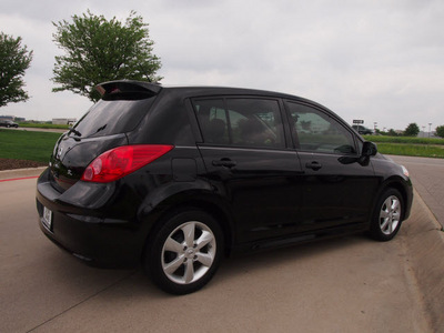 nissan versa 2011 black hatchback 1 8 sl gasoline 4 cylinders front wheel drive automatic with overdrive 76018