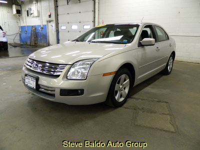 ford fusion 2009 beige sedan se gasoline 4 cylinders front wheel drive automatic 14304
