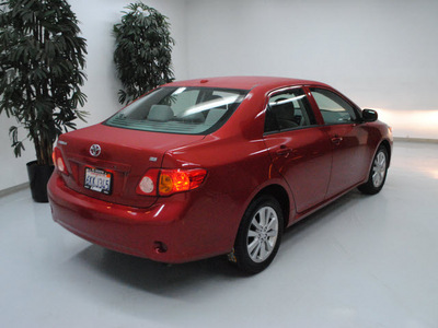 toyota corolla 2010 red sedan le gasoline 4 cylinders front wheel drive automatic 91731