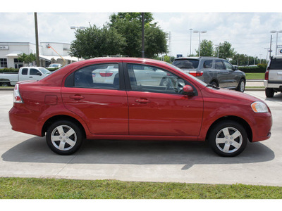 chevrolet aveo 2011 red sedan lt gasoline 4 cylinders front wheel drive automatic 77090