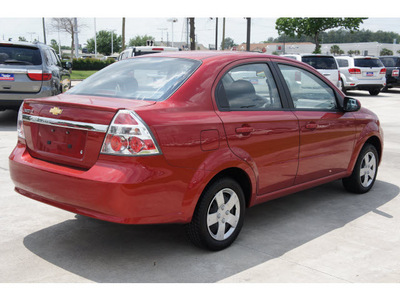 chevrolet aveo 2011 red sedan lt gasoline 4 cylinders front wheel drive automatic 77090