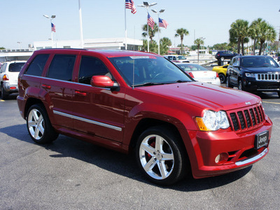 jeep grand cherokee 2010 red suv srt8 gasoline 8 cylinders 4 wheel drive automatic 33021